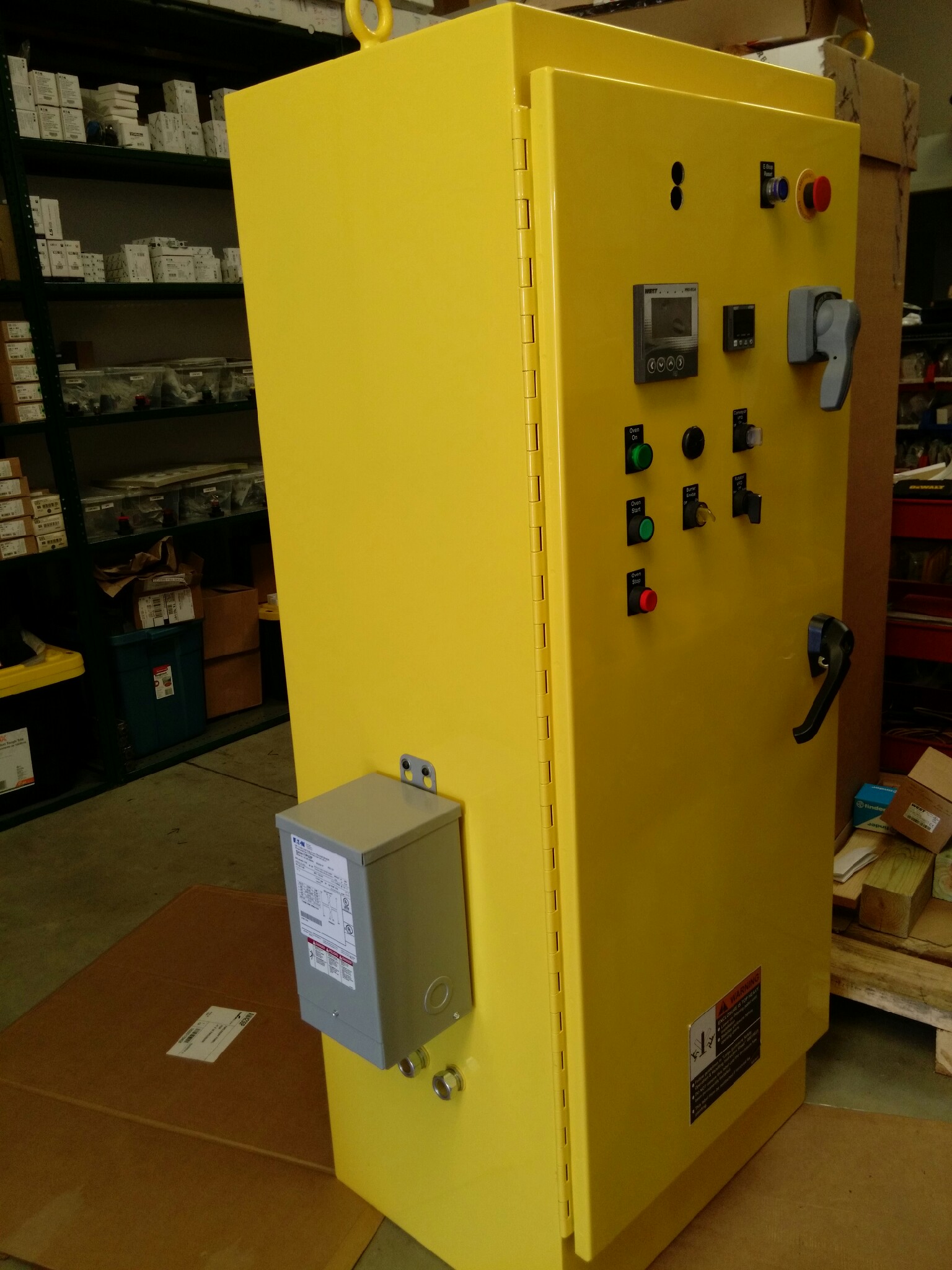 Finished yellow industrial control cabinet built by Customized Controls