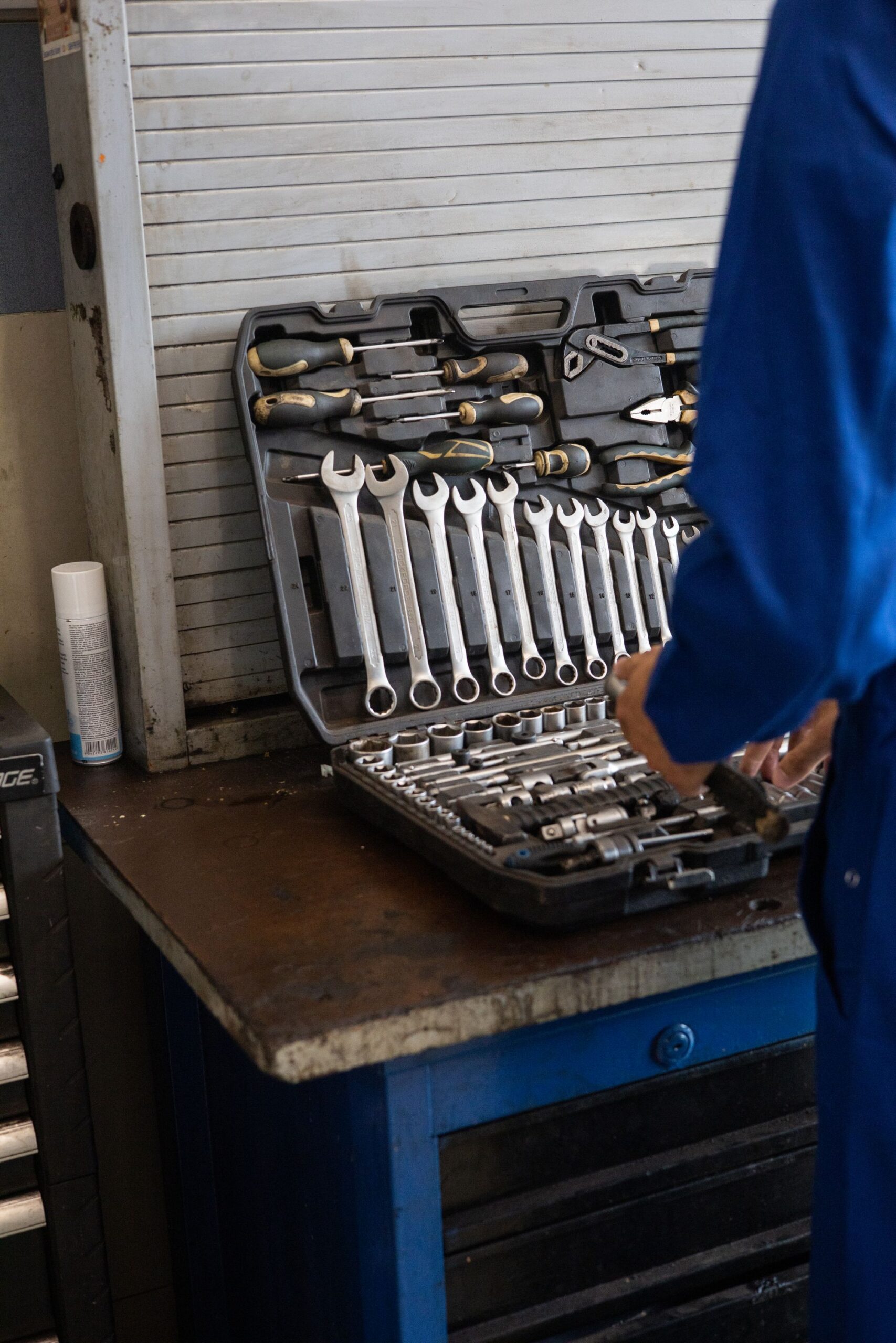 Mechanic organizing professional tools in an industrial workshop