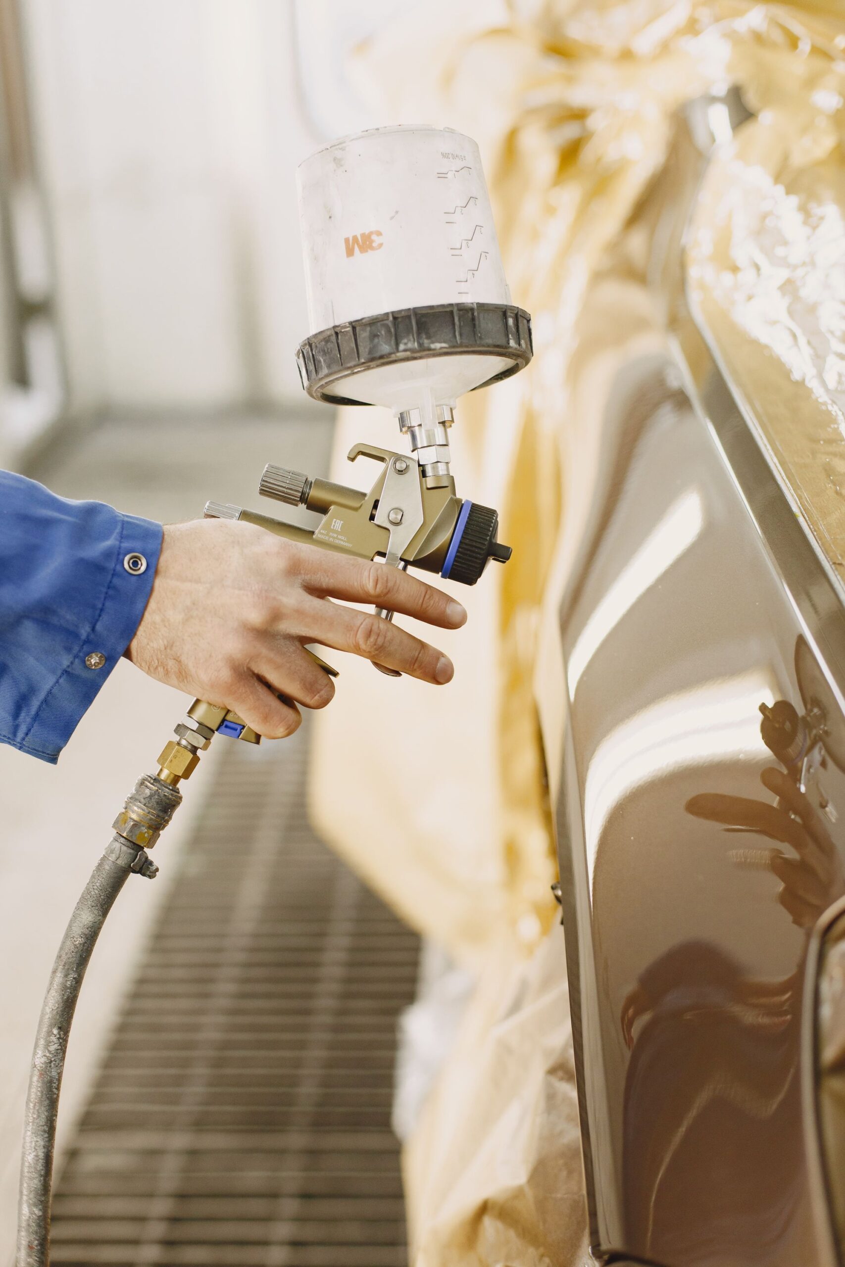 Representative liquid spray finishing in a professional workshop
